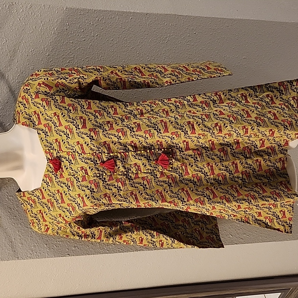 Never worn green top with red bird trim. Made in India. Size small.